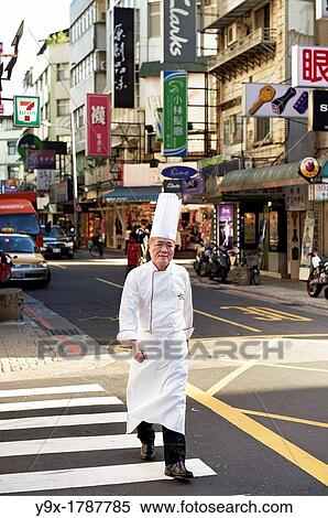 Head Chef Huang Lai Fa of The Grand Formosa Regent Hotel Taipei, posing and sampling food on Yongkang Street in Taipei, Taiwan View Large Photo Image Stock Photography - Head Chef Huang Lai Fa of The Grand Formosa Regent Hotel Taipei, posing and sampling food on Yongkang Street in Taipei, Taiwan. Fotosearch