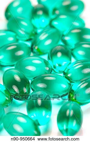 Picture - Headache Capsules isolated against a white background. Fotosearch