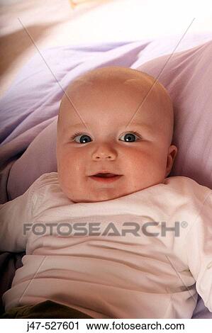 Headshot, 4 month old baby smling into camera View Large Photo Image Stock Image - Headshot, 4 month old baby smling into camera. Fotosearch