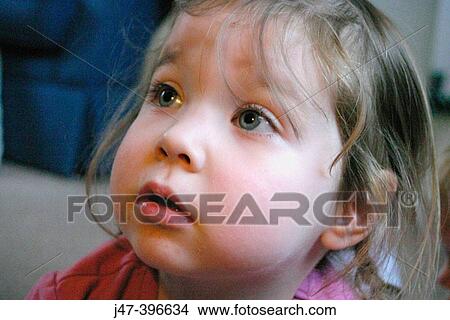 Picture - Headshot of 3 year old girl, looking up. Fotosearch