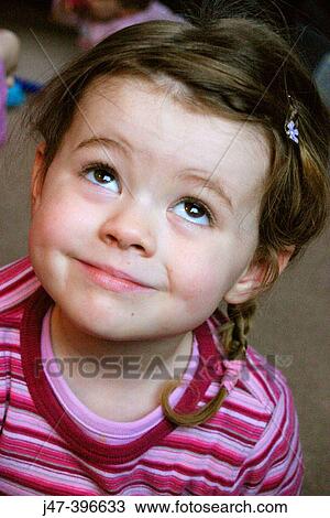 Headshot of 3 year old girl, with plaits and stripey top, looking up View Large Photo Image Stock Image - Headshot of 3 year old girl, with plaits and stripey top, looking up. Fotosearch