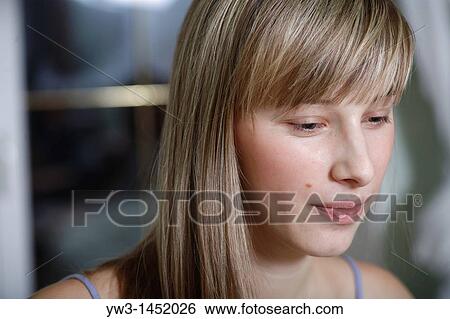 Headshot of a 24 year old blonde Caucasian woman wearing a tank top indoors View Large Photo Image Stock Photograph - Headshot of a 24 year old blonde Caucasian woman wearing a tank top indoors. Fotosearch