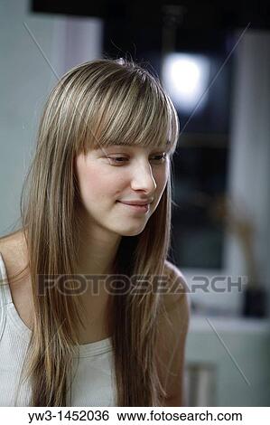 Headshot of a 24 year old blonde Caucasian woman wearing a tank top indoors View Large Photo Image Stock Photograph - Headshot of a 24 year old blonde Caucasian woman wearing a tank top indoors. Fotosearch