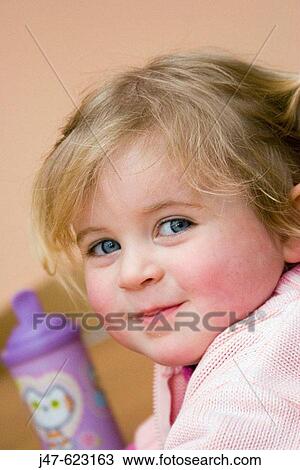 Headshot of a 3 year old girl smiling into camera, cheekily View Large Photo Image Stock Image - Headshot of a 3 year old girl smiling into camera, cheekily. Fotosearch
