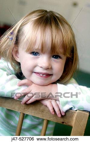 Headshot of a 3 year old girl smiling into camera at nursery View Large Photo Image Stock Photograph - Headshot of a 3 year old girl smiling into camera at nursery. Fotosearch