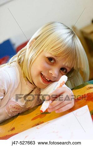 Headshot of a 4 year old girl smiling into camera at nursery, drawing View Large Photo Image Stock Image - Headshot of a 4 year old girl smiling into camera at nursery, drawing. Fotosearch