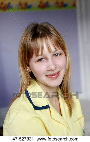 Headshot of a nursery nurse at work, wearing her uniform View Large Photo Image Stock Image - Headshot of a nursery nurse at work, wearing her uniform. Fotosearch