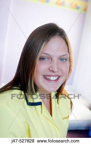 Headshot of a nursery nurse at work, wearing her uniform View Large Photo Image Stock Photo - Headshot of a nursery nurse at work, wearing her uniform. Fotosearch