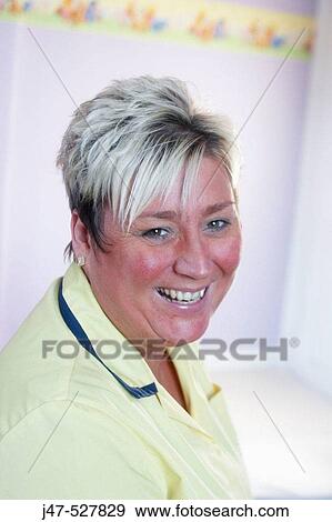 Headshot of a nursery nurse at work, wearing her uniform View Large Photo Image Stock Photo - Headshot of a nursery nurse at work, wearing her uniform. Fotosearch