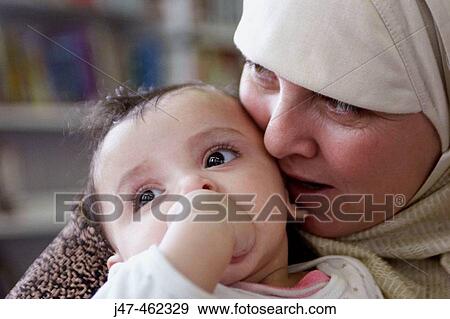 Headshot of arabic mother and child View Large Photo Image Stock Photo - Headshot of arabic mother and child. Fotosearch