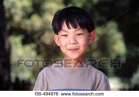 Headshot of cute Asian boy View Large Photo Image Stock Photograph - Headshot of cute Asian boy. Fotosearch