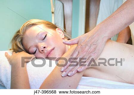 headshot of girl having a back massage in a salon View Large Photo Image Stock Photo - headshot of girl having a back massage in a salon. Fotosearch