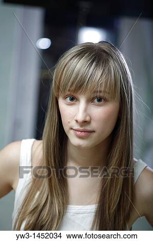 Picture - headshot of the pretty blond women weared tank top indoors front view Caucasian, 24 years old. Fotosearch