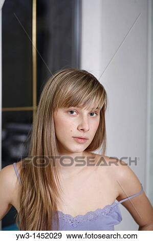 headshot of the pretty blond women weared tank top indoors front view Caucasian, 24 years old View Large Photo Image Stock Photo - headshot of the pretty blond women weared tank top indoors front view Caucasian, 24 years old. Fotosearch