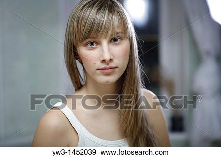 headshot of the pretty blond women weared tank top indoors front view Caucasian, 24 years old View Large Photo Image Stock Photo - headshot of the pretty blond women weared tank top indoors front view Caucasian, 24 years old. Fotosearch