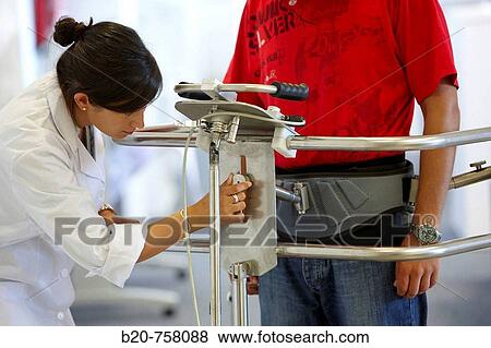 Stock Photo - Health and Quality of life Unit researcher developing a mobile walking device, FIK technology research program for aged and disabled people. Fatronik-Tecnalia, Research and Technology Center, Donostia, Basque Country, Spain. Fotosearch
