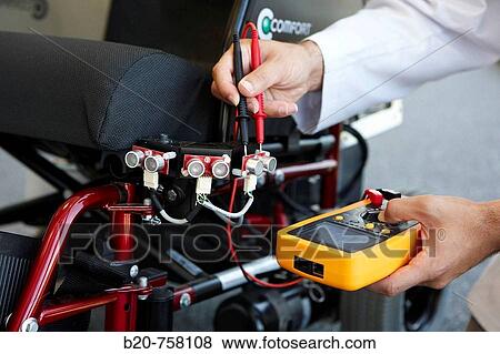 Stock Photo - Health and Quality of life Unit researchers developing a control system for intelligent power wheelchair, FIK technology research program for aged and disabled people. Fatronik-Tecnalia, Research and Technology Center, Donostia, Basque Country, Spain. Fotosearch