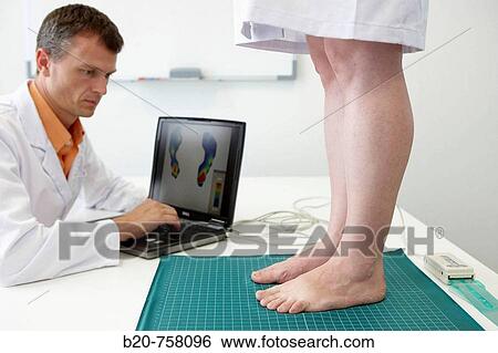 Stock Photograph - Health and Quality of life Unit researcher monitoring the plantar pressure distribution on the sole of foot, FIK technology research program for aged and disabled people. Fatronik-Tecnalia, Research and Technology Center, Donostia, Basque Country, Spain. Fotosearch
