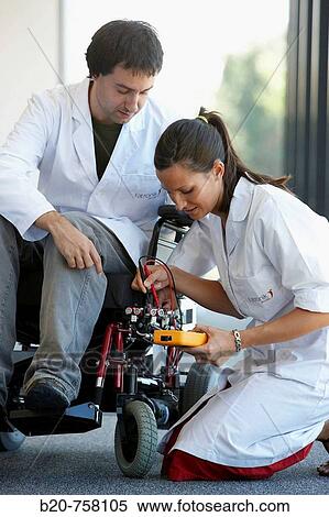 Stock Photography - Health and Quality of life Unit researchers developing a control system for intelligent power wheelchair, FIK technology research program for aged and disabled people. Fatronik-Tecnalia, Research and Technology Center, Donostia, Basque Country, Spain. Fotosearch