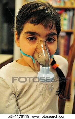 Health - young girl of 8 suffers from Asthma oxygen humidifier inhaler helps her breath - Model Release available View Large Photo Image Stock Photo - Health - young girl of 8 suffers from Asthma oxygen humidifier inhaler helps her breath - Model Release available. Fotosearch