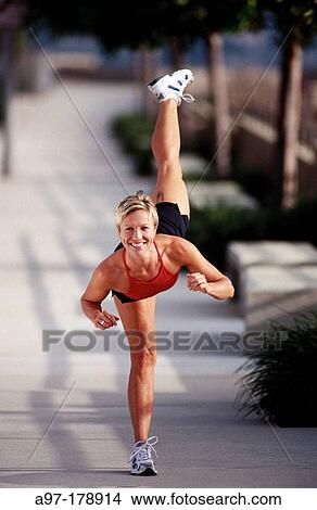Picture - Healthy and fit woman outdoors. Fotosearch