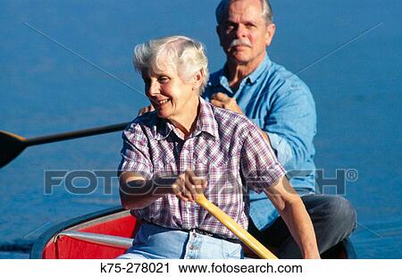 Healthy senior couple canoeing View Large Photo Image Stock Image - Healthy senior couple canoeing. Fotosearch