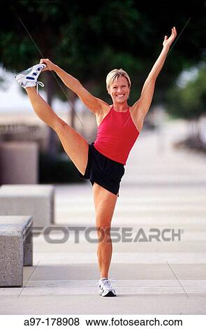Healthy woman does exercise outdoors View Large Photo Image Stock Photo - Healthy woman does exercise outdoors. Fotosearch