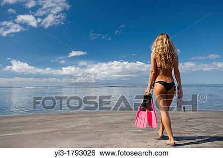 Healthy woman heads out to snorkel at Olowalu, Maui, Hawaii View Large Photo Image Stock Photograph - Healthy woman heads out to snorkel at Olowalu, Maui, Hawaii. Fotosearch