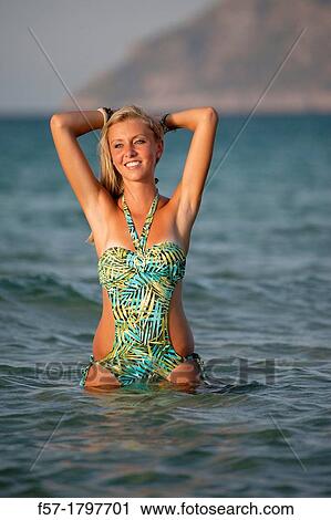 Healthy young woman at the beach View Large Photo Image Stock Image - Healthy young woman at the beach. Fotosearch