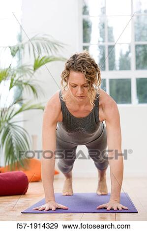 Healthy young woman doing the plank pose yoga position View Large Photo Image Stock Photo - Healthy young woman doing the plank pose yoga position. Fotosearch