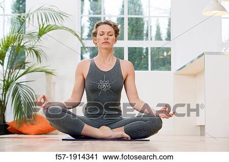 Healthy young woman doing the auspicious pose yoga position View Large Photo Image Stock Image - Healthy young woman doing the auspicious pose yoga position. Fotosearch