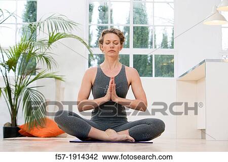 Healthy young woman doing the auspicious pose yoga position View Large Photo Image Stock Image - Healthy young woman doing the auspicious pose yoga position. Fotosearch
