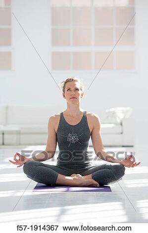 Healthy young woman doing the auspicious pose yoga position View Large Photo Image Stock Photo - Healthy young woman doing the auspicious pose yoga position. Fotosearch