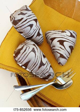 Hearts of pure chocolate and white chocolate View Large Photo Image Stock Photograph - Hearts of pure chocolate and white chocolate. Fotosearch