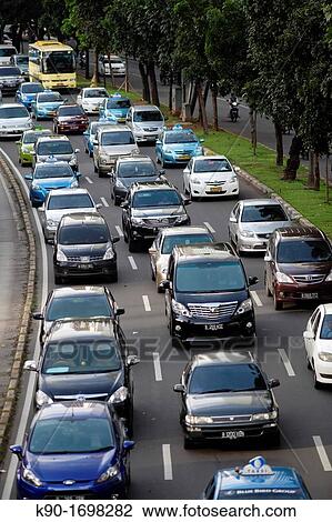 Heavy traffic seen from above on Jalan Sudirman with separated bus lane, Central Business District of Jakarta, Indonesia, Southeast Asia View Large Photo Image Stock Image - Heavy traffic seen from above on Jalan Sudirman with separated bus lane, Central Business District of Jakarta, Indonesia, Southeast Asia. Fotosearch