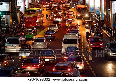 Heavy traffic seen from backside and from above on Ploenchit Road, Central Business District of Bangkok, Thailand, Southeast Asia View Large Photo Image Stock Image - Heavy traffic seen from backside and from above on Ploenchit Road, Central Business District of Bangkok, Thailand, Southeast Asia. Fotosearch