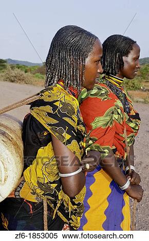 Hegrmarian Ethiopia Africa Lower Omo Valley sunset portrait of young Borena tribe girls with colorful outfits in open reserve 29 View Large Photo Image Stock Photography - Hegrmarian Ethiopia Africa Lower Omo Valley sunset portrait of young Borena tribe girls with colorful outfits in open reserve 29. Fotosearch