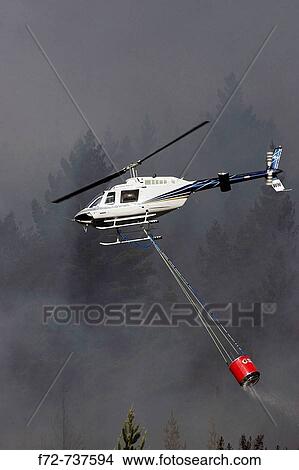 Helicopter Fighting Forest Fire, Dunedin, South Island, New Zealand View Large Photo Image Picture - Helicopter Fighting Forest Fire, Dunedin, South Island, New Zealand. Fotosearch
