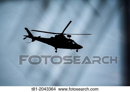 Helicopter flying over the sky of Valencia, Spain View Large Photo Image Picture - Helicopter flying over the sky of Valencia, Spain. Fotosearch