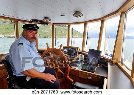 helmsman at the helm of Belle Epoque paddle steamer La Suisse on Leman Lake, Lausanne, Canton of Vaud, Switzerland, Europe. View Large Photo Image Stock Image - helmsman at the helm of Belle Epoque paddle steamer La Suisse on Leman Lake, Lausanne, Canton of Vaud, Switzerland, Europe.. Fotosearch