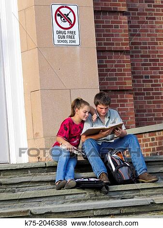 Helping each other with homework View Large Photo Image Stock Photo - Helping each other with homework. Fotosearch