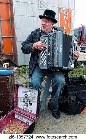 Helsinki Finland famous festival Herring Market on Waterfront man playing accordian at party View Large Photo Image Picture - Helsinki Finland famous festival Herring Market on Waterfront man playing accordian at party. Fotosearch