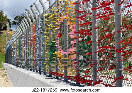 Stock Photo - Henoko, Okinawa, Japan, colored stripes to protest against the American military occupation of Okinawa and the use of V-22 Osprey helicopters. Fotosearch