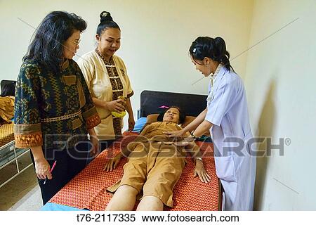 herbal compress massage treatment at a traditional Thai medicine clinic in Bangkok, Thailand. View Large Photo Image Stock Photography - herbal compress massage treatment at a traditional Thai medicine clinic in Bangkok, Thailand.. Fotosearch