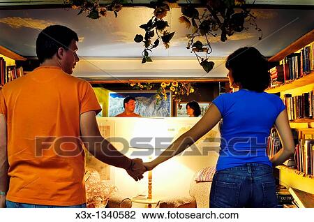 Heterosexual couple holding hands View Large Photo Image Stock Image - Heterosexual couple holding hands. Fotosearch