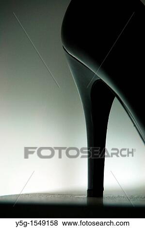 high heel shoe on display in shop window at night View Large Photo Image Stock Photo - high heel shoe on display in shop window at night. Fotosearch