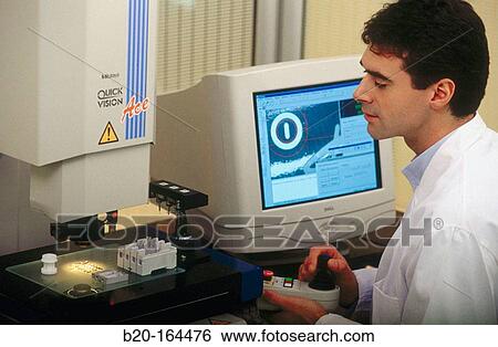 Stock Photograph - High precision metrology, coordinate measuring machine, car engine component. Fotosearch