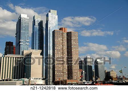 High rise apartment buildings on 42nd Street near The Hudson River. Theater District. Manhattan. New York, New York. USA. View Large Photo Image Stock Photo - High rise apartment buildings on 42nd Street near The Hudson River. Theater District. Manhattan. New York, New York. USA.. Fotosearch