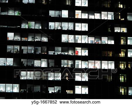 high rise office block in city at night View Large Photo Image Stock Image - high rise office block in city at night. Fotosearch