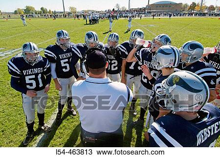 High School football action as coach plans stragedy by talking and directing plays and giving advice to players between plays View Large Photo Image Stock Image - High School football action as coach plans stragedy by talking and directing plays and giving advice to players between plays. Fotosearch